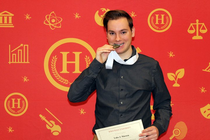 Luke Marzen pictured, looking very handsome just after receiving a medal for graduating the University Honors Program.